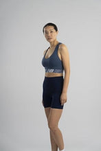 Load image into Gallery viewer, New Balance Womens Seamless Wirefree, Racerback Sports Bra with Removable Pads, Bottom Band with Logo, Camo Vintage Indigo