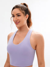 Load image into Gallery viewer, JOYSPELS Sports Bras for Women Extra Comfort Criss-Cross Back Padded Workout Tops for Women Medium Support Light Purple