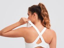 Load image into Gallery viewer, JOYSPELS Sports Bras for Women Extra Comfort Criss-Cross Back Padded Workout Tops for Women Medium Support White