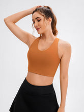 Load image into Gallery viewer, JOYSPELS Sports Bras for Women Extra Comfort Criss-Cross Back Padded Workout Tops for Women Medium Support