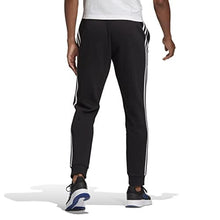 Load image into Gallery viewer, adidas Men&#39;s Standard Essentials Fleece Tapered Cuff 3-Stripes Pants, Black/White, Medium
