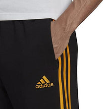 Load image into Gallery viewer, adidas Men&#39;s Essentials Fleece Tapered Cuff 3-Stripes Pants, Black/Semi Solar Gold, X-Small
