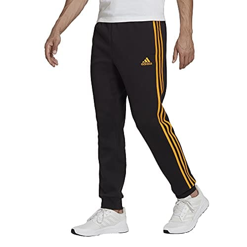 adidas Men's Essentials Fleece Tapered Cuff 3-Stripes Pants, Black/Semi Solar Gold, X-Small